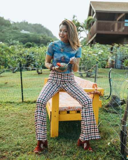 Personal brand portrait seated in a garden