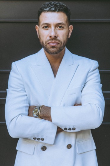Personal brand portrait, white suit, arms crossed