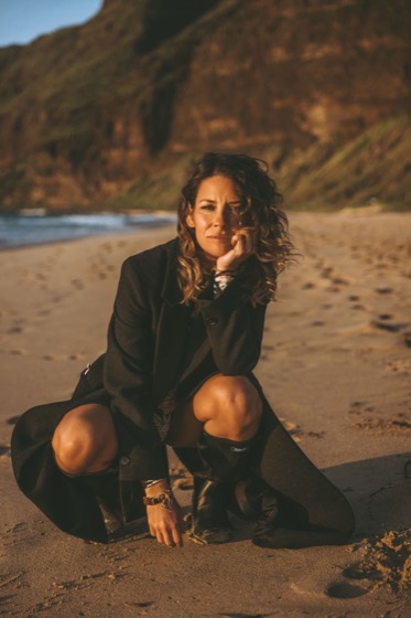 Cinematic personal brand portrait on a beach at golden hour
